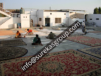 rug factory showing finishing process of custom rugs