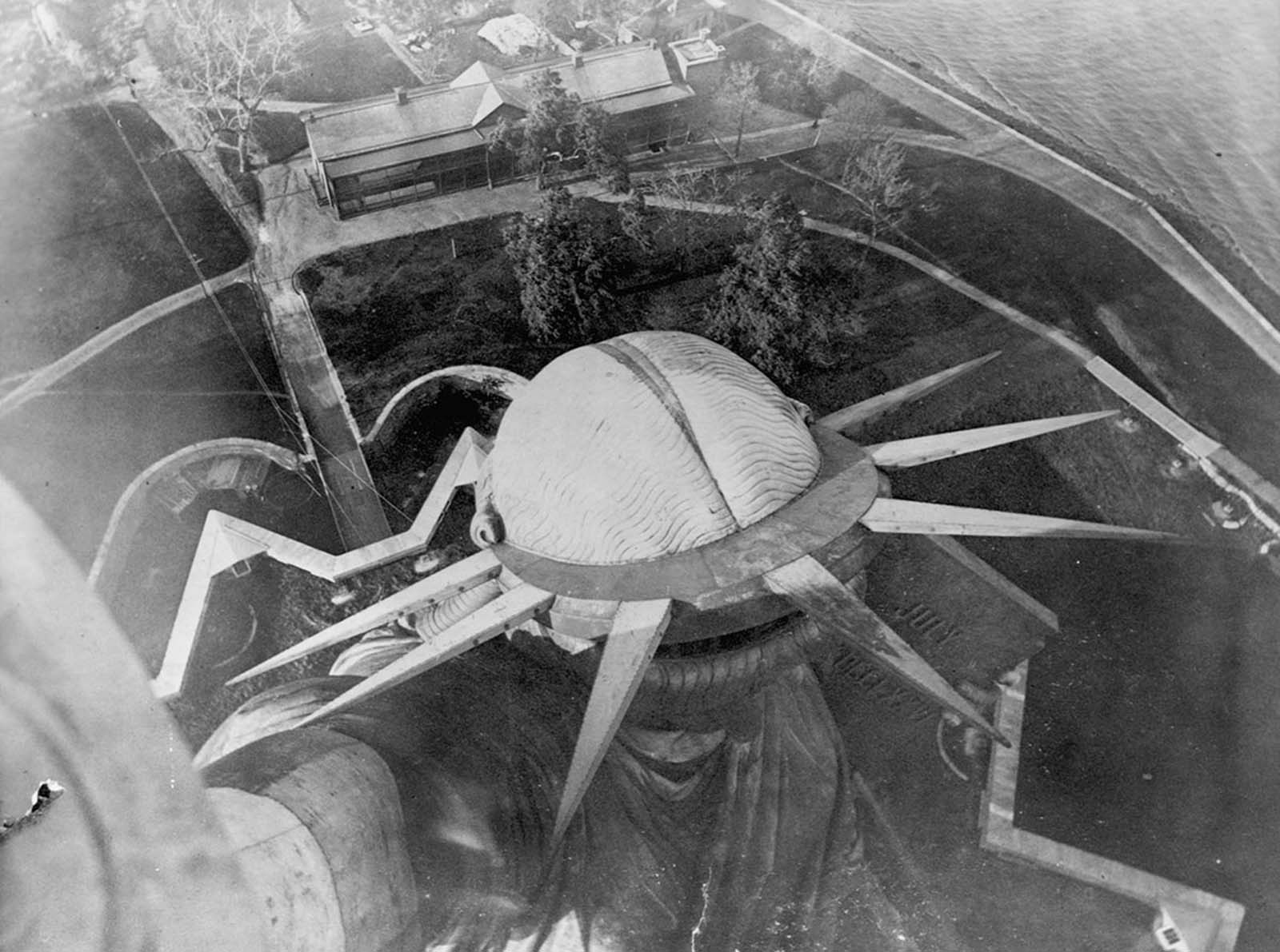 Looking down at the statue from its torch, circa 1890.