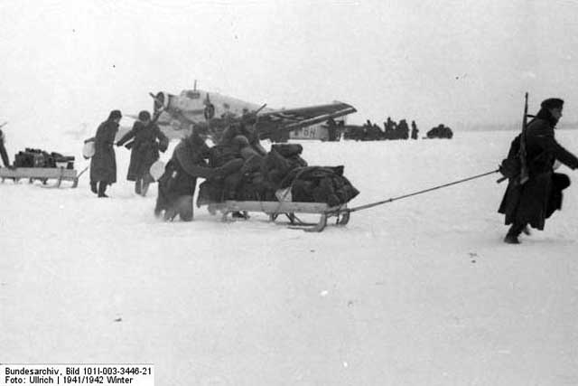 German soldiers unloading a Junkers Ju 52 in the Demyansk pocket, January 1942 Worldwartwo.filminspector.com