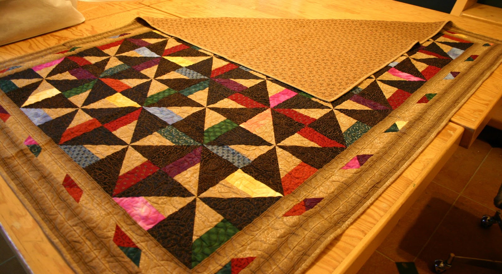 Today in Kenogami Folding a Quilt for Storage