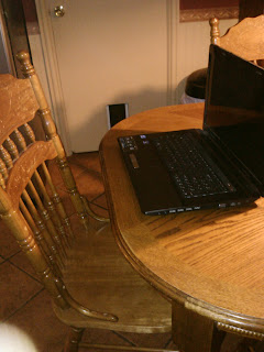 laptop at the kichen table