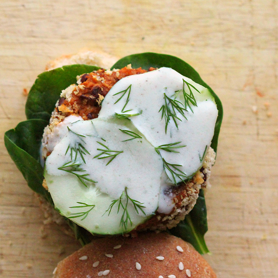 Burger patty topped with cucumber, dill, and vegan aioli