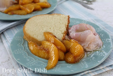 Fresh peaches, tossed in fresh lemon juice and skillet cooked in a buttery, brown sugar sauce with cinnamon, vanilla and a bit of whisky or bourbon, if you like.