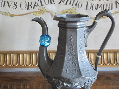 ring displayed on spout of tea pot