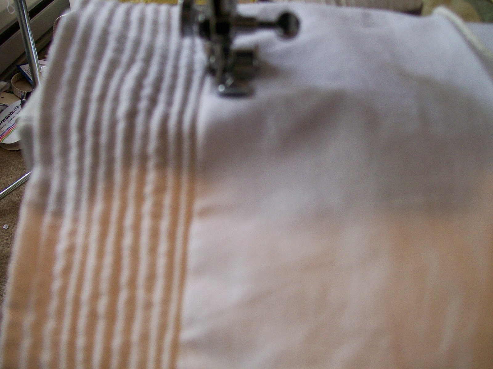 Cording petticoat on sewing machine with zipper foot. Cording petticoat on sewing machine with zipper foot.