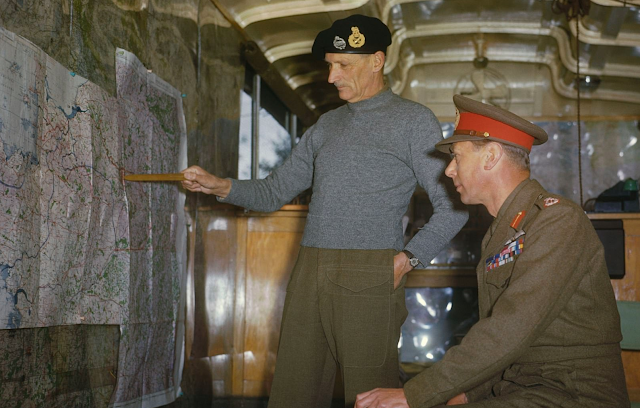 Field Marshal Sir Bernard Montgomery pointing out the German West Wall region to King George VI color photos of World War II worldwartwo.filminspector.com