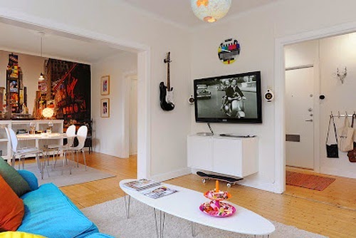 Beautiful White Room with Blue Sofa with White Dining
