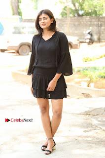 Actress Hebah Patel Stills in Black Mini Dress at Angel Movie Teaser Launch  0006