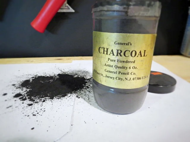 canister of powdered charcoal