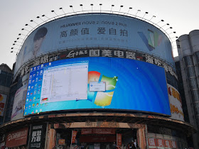 Windows desktop screen appearing on a digital billboard