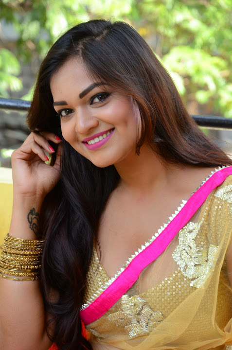 Ashwini Cleavage in Yellow Saree