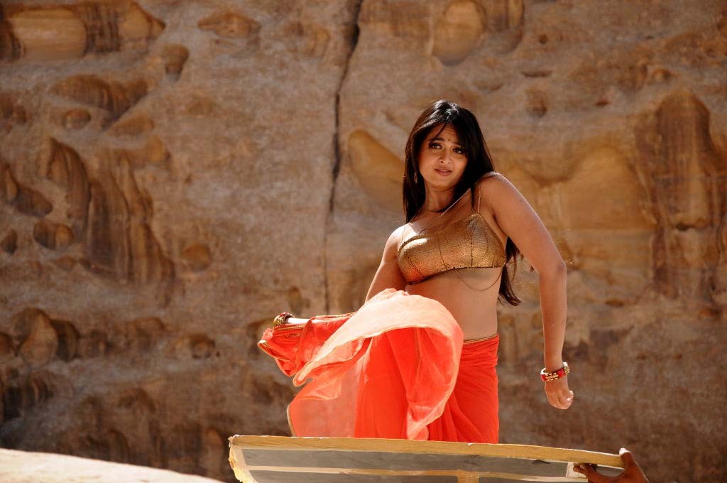 Hot Navel Show Photos Of Anushka Shetty In Orange Saree