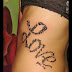 CURLY LOVE TATTOO ON SIDE BODY
