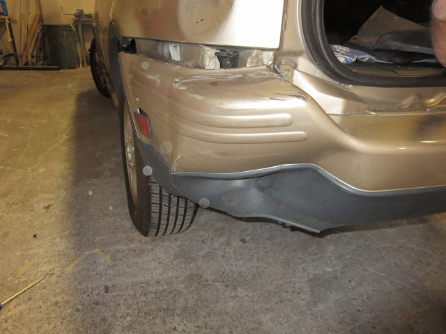 Damaged bumper and quarter panel before repairs at Almost Everything Auto Body