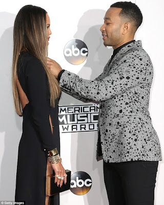 1a5 Chrissy Teigen attends the 2016 AMA in a very high slit dress and no underwear