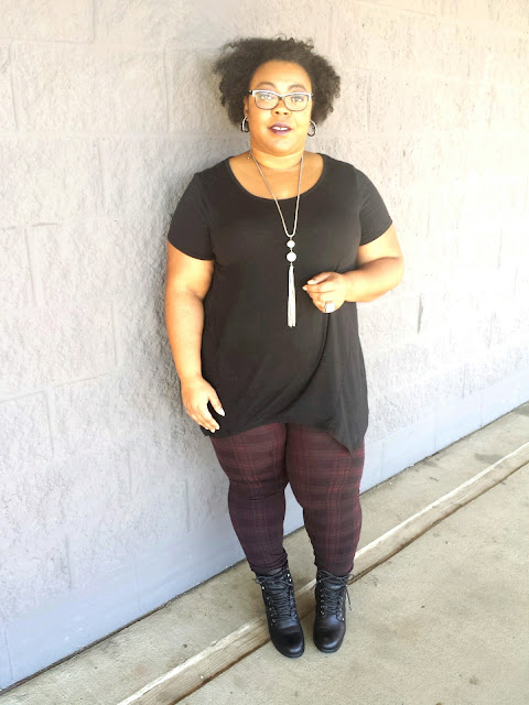 plus size gothic glam, black tunic, printed leggings, stacked booties, tassel necklace, natural hair, trendy