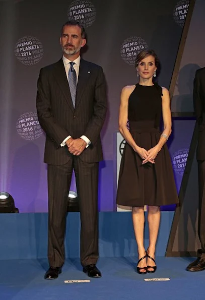 Queen Letizia wore Signe Bøgelund Jensen Two Fold Skirt, Tod's. Black Satin Clutch, Magrit Sandals