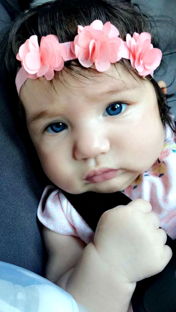blue eyed baby with a pink headband blue eyed baby with a pink headband