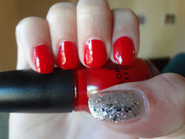 red nails with silver glitter accent