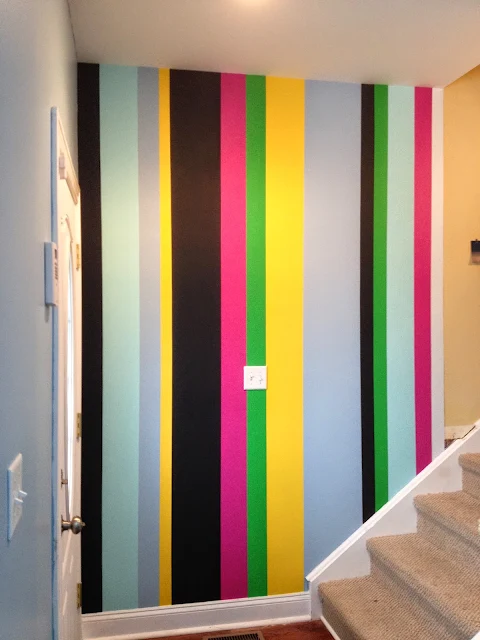 colorful painted stripe entry wall finished