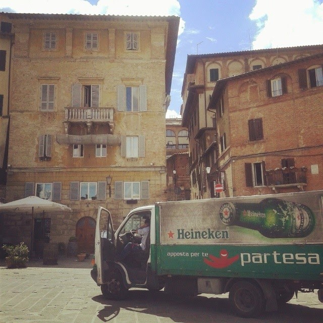A driver of a Heineken truck having a Siesta in Siena