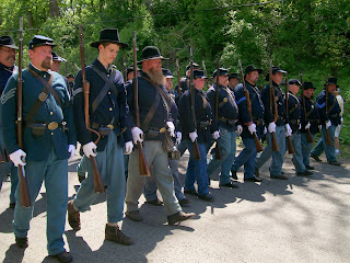 Reenactor soldiers marching in 150th Anniversary Lincoln Funeral Procession. Reenactor soldiers marching in 150th Anniversary Lincoln Funeral Procession.
