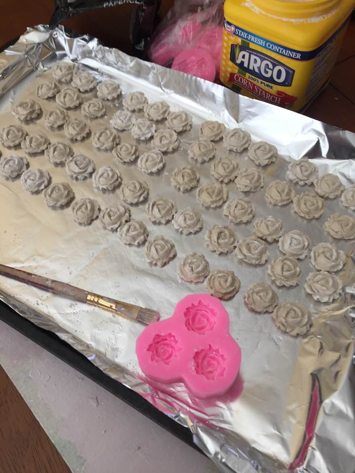 Rosettes made of paperclay drying on tray. Rosettes made of paperclay drying on tray.
