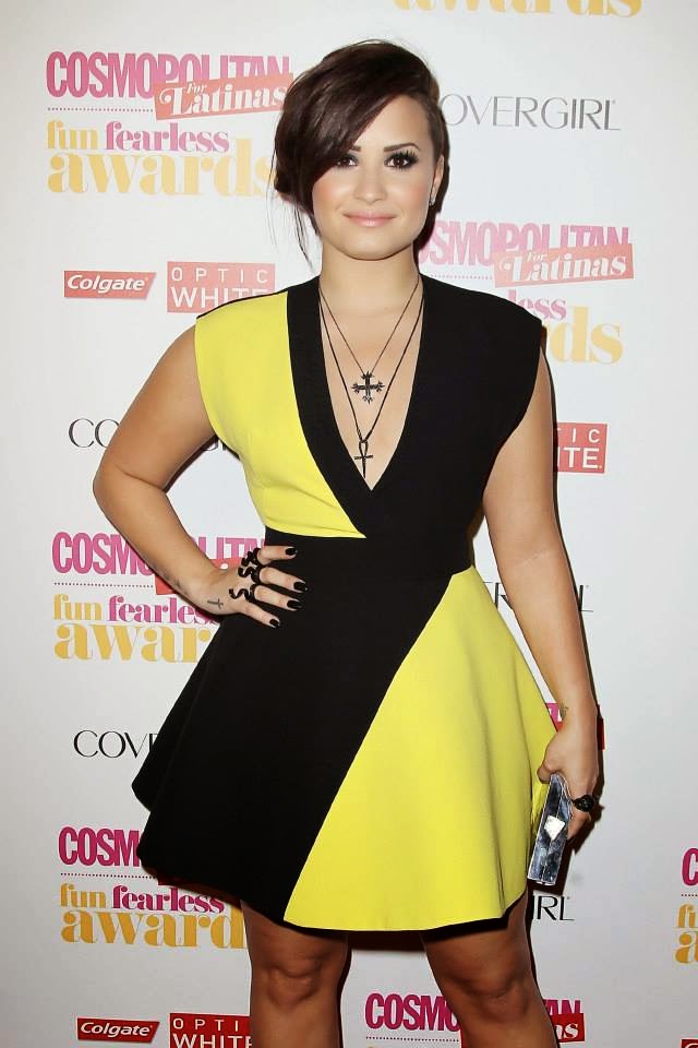 Singer Demi Lovato walks the red carpet at Cosmopolitan for Latinas Fun Fearless Awards 2014 in New York City