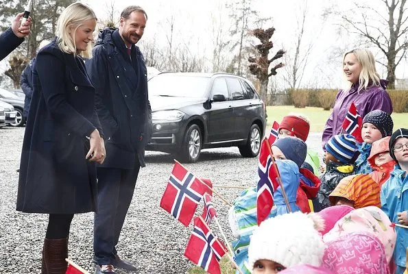 Crown Princess Mette-Marit wore Valentino coat and she wore Prada Brown Knee High Crocodile Boots. Telemark Rjukan-Notodden heritage site