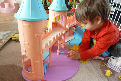 Child playing with My Little Pony Dream Castle