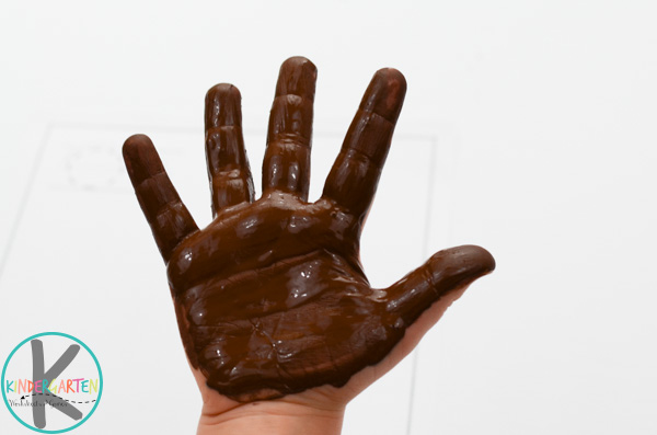 brown paint on hand