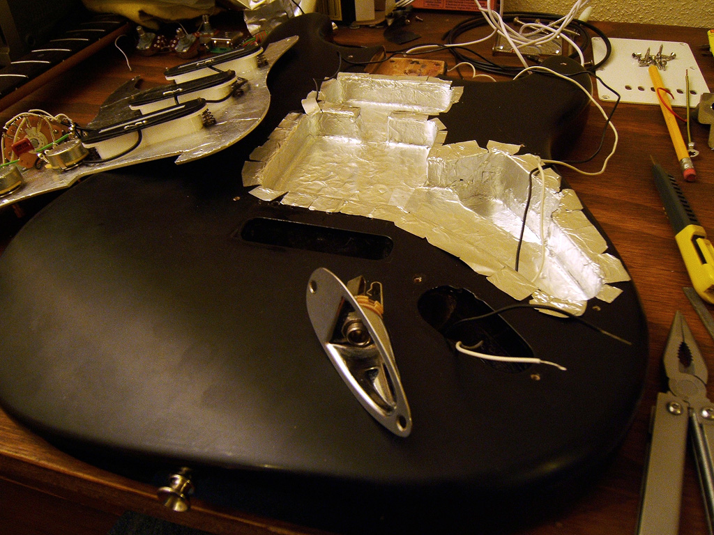 Now we go back to the body and start soldering the jack plate to the wires and put it back in place.