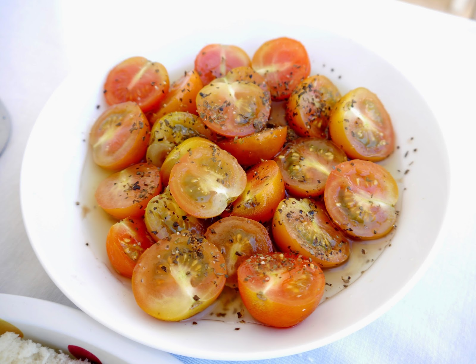tomatoes in olive oil and basil