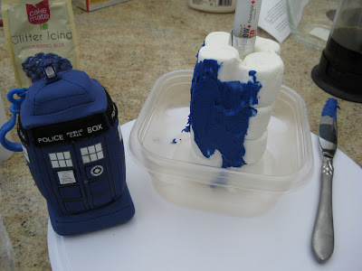 covering marshmallow tardis with icing