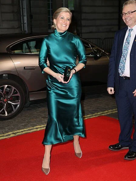 The Countess of Wessex wore a new silk-satin midi dress by Galvan London. BAFTA nominated director Julian Jarrold