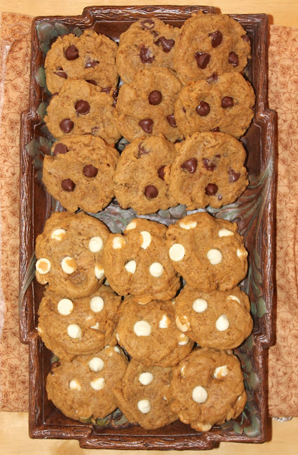 Platter of chocolate chip pumpkin cookies with half semi-sweet chocolate and half white chocolate.