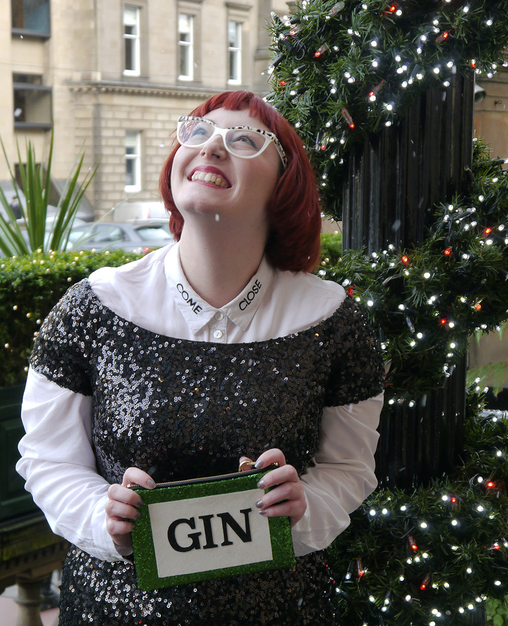 Feeling festive with SoS15 styled by, styled by helen, Christmas party outfit, party outfit, sequined outfit, sequined jumpsuit, glitter clutch bag, party clutch bag, SoS15, gin bag, gin clutch bag, festive party outfit inspiration, black sequined jumpsuit, catsuit, faux tuxedo style, scottish blogger, fashion blogger style, Edinburgh blogger, red head, Spex Pistol glasses, statement glasess, shop small, London designer, UK designer, independent designer UK, statement bag