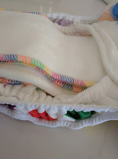 The double gussets pop up to give extra room in the nappy for boosting and a nice leg seal.