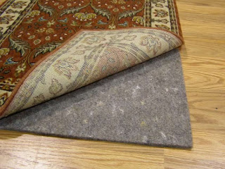 Superior non slip with moderate cushion an comfort carpet pad for area rugs thin high quality synthetic grey with scratch coloured easy folding and cleaning
