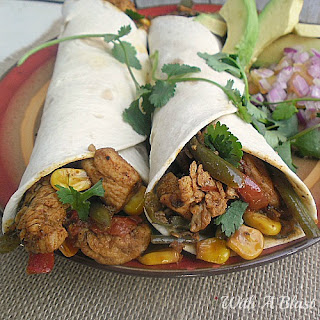 Spicy Mexican Chicken Wraps ~ Spicy Chicken and Mexican Vegetables wraps which is perfect to serve during the cooler days as lunch or dinner {quick and easy too!} #ChickenRecipe #ChickenWrap #MexicanWrap www.WithABlast.net