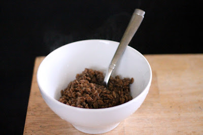 A bowl of oatmeal made with second runnings of an oatmeal stout in place of the water.