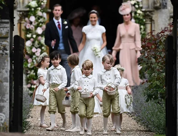 Duchess Catherine, her children Prince George of Cambridge, page boy and Princess Charlotte of Cambridge, flower girl attend the wedding of Pippa Middleton