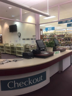 Checkout Desk desk with the word checkout on it