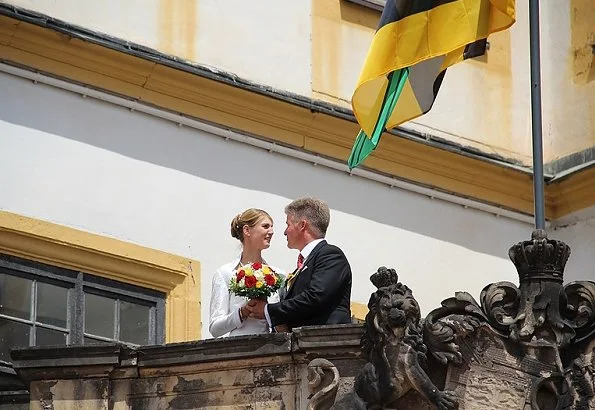 Princess Stephanie of Saxe-Coburg and Gotha wore a white silk wedding dress from German fashion designer Gordon Sieverding, who is based in Michelau