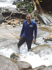 "Travel Trikon" trek leader Mr Yuvraj Sagvekar having a dip in the waterfalls river.