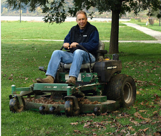 leaf mulching in action - riding a mulching mower in the park