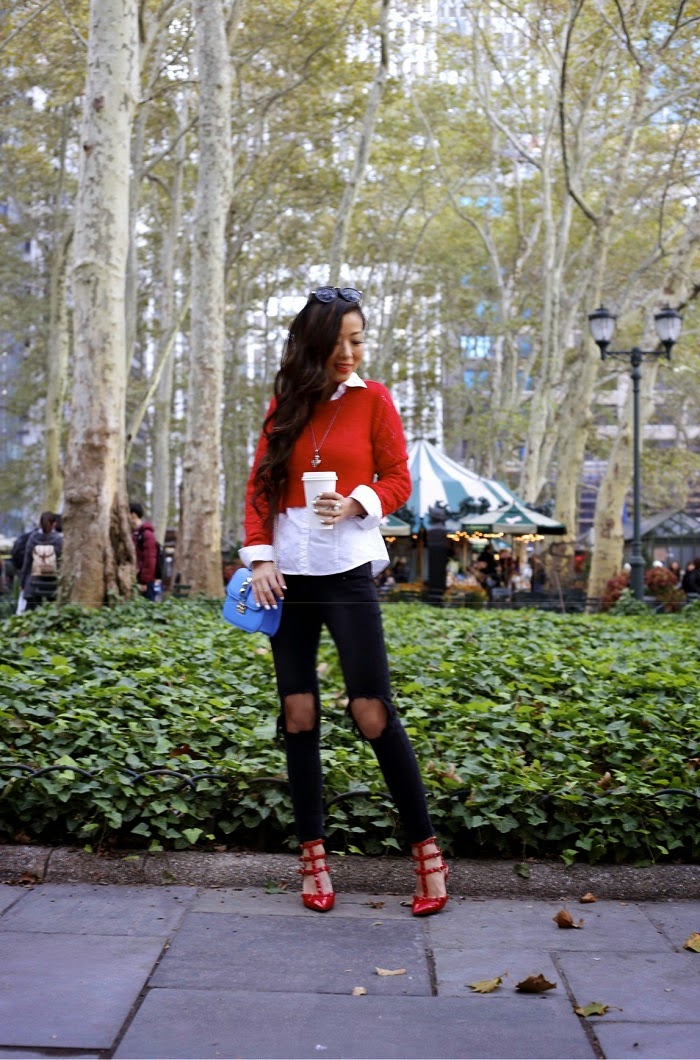 lucca couture sweater,red sweater,holiday outfit, holiday outfit ideas, holiday essential, unif jeans, valentino rock studs, valentino lock bag, babublebar 360 pearl studs earrings, alexander mcqueen skull necklace, karen walker sunglasses, New york city, fashion blog, street style, holiday, bryant park, city view, shallwesasa