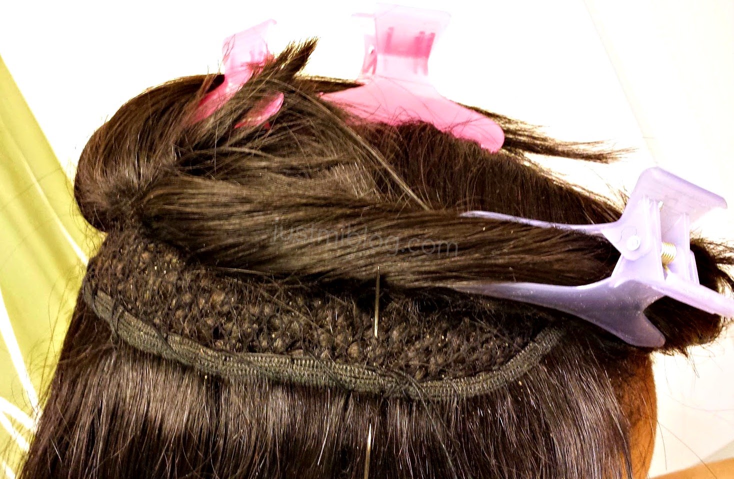 re-sewing extensions or track into natural hair