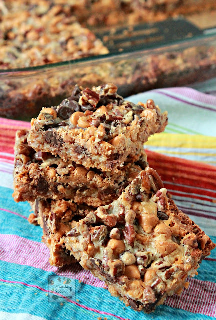  These cookie bars are truly so delicious and super easy to make!! With layers of graham crackers, coconut, pecans, butterscotch and choco chips - your tastebuds are in for a yummy treat!