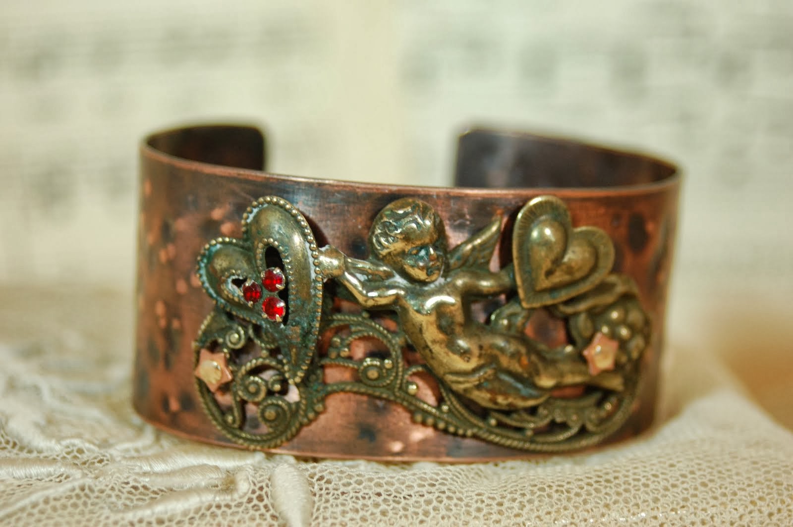 Cooper cuff with vintage cupid pin